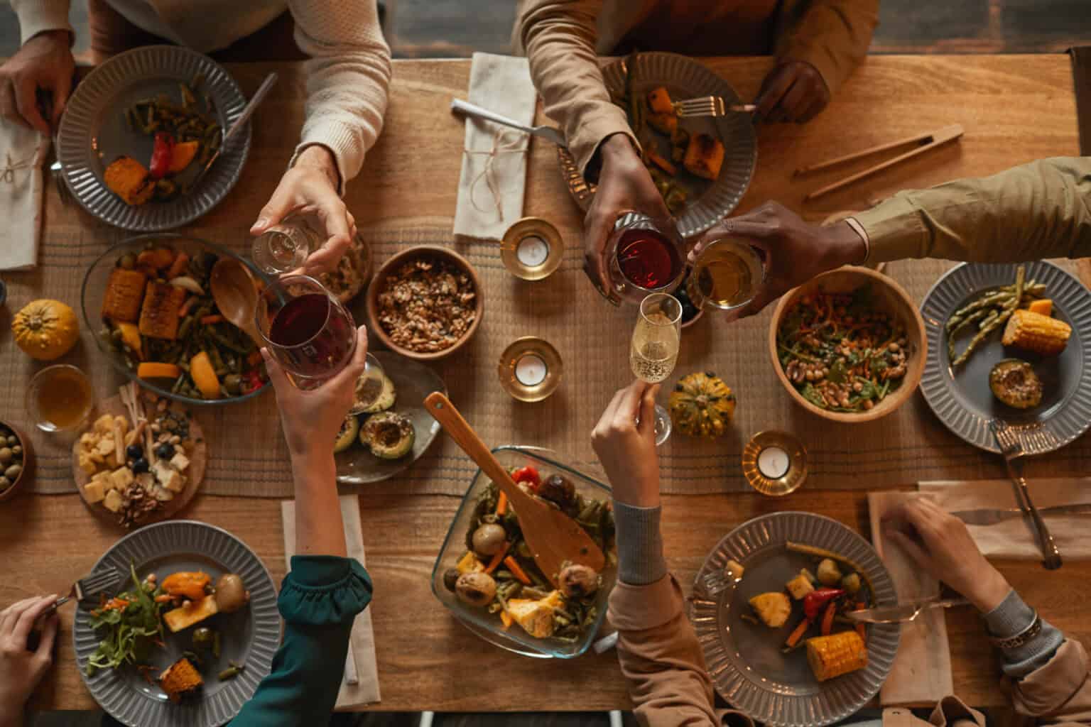 Group of people enjoying feast during dinner party with friends and family